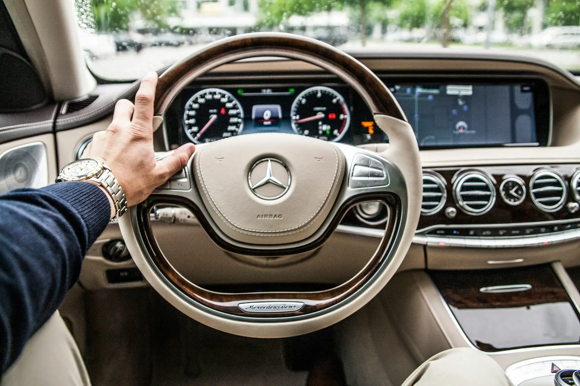 person sitting in Mercedes S class drivers seat Beautiful beige interior