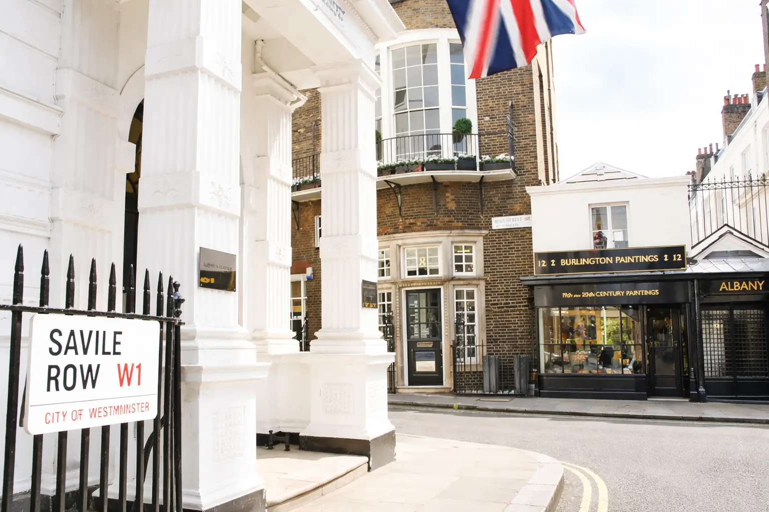 Savile Row W1 street sign and Georgian buildings in Westminster London.