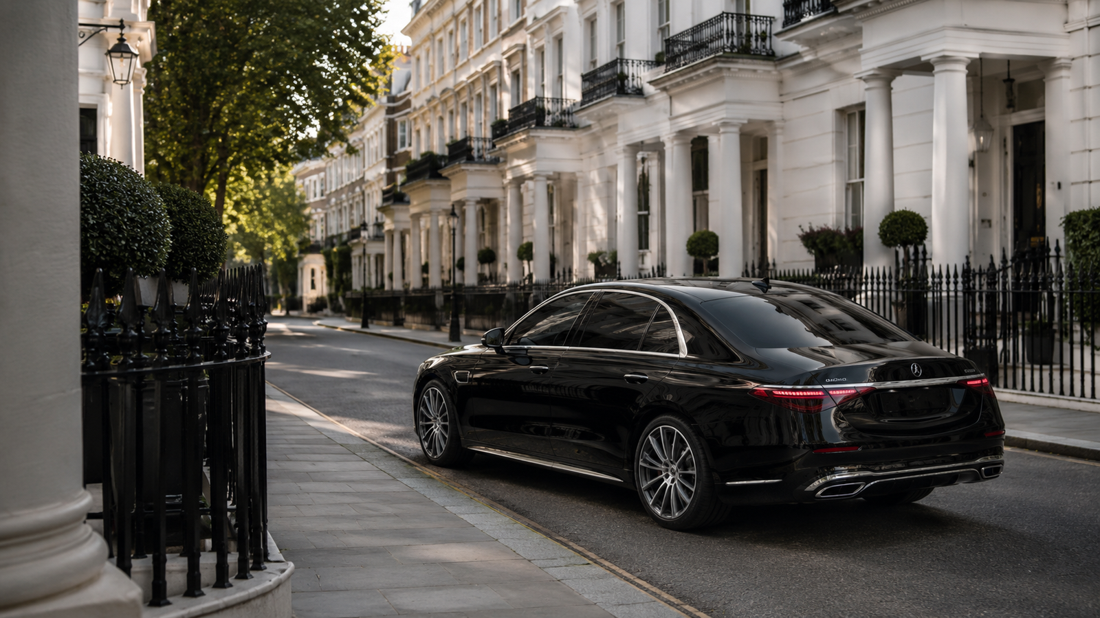 Black luxury chauffeur car on a Georgian residential street in Belgravia, London